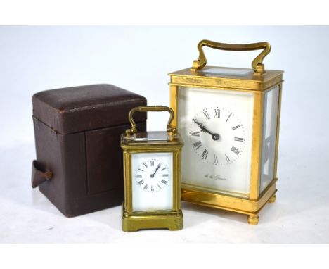 A miniature gilt brass carriage clock with white enamelled dial, in brown leather case 8 cm high overall, to/w a 'de la Grens