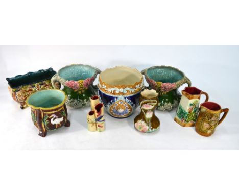 A collection of continental majolica including a pair of twin handle vases, a rectangular planter, a planter decorated with b