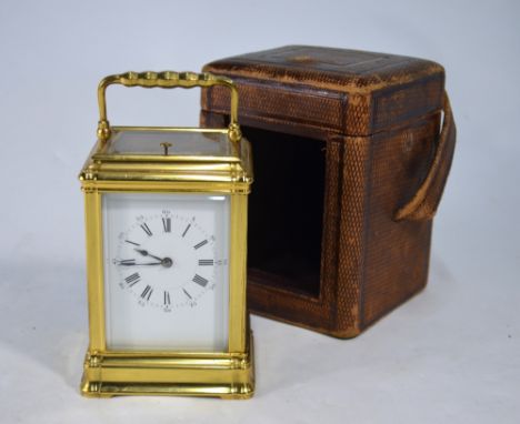 A 19th century French brass carriage clock, the 8-day two-train repeating movement striking the hours and halfs on a spiral g