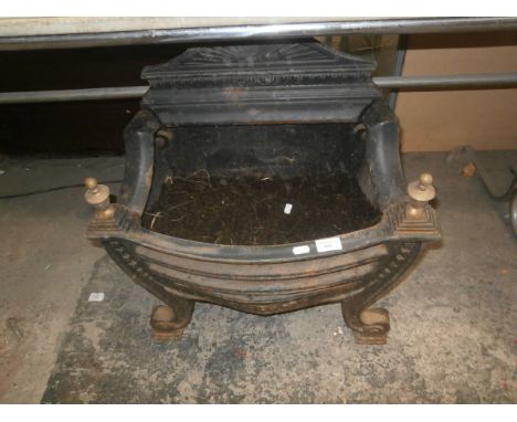 cast iron fire grate currently full of soil