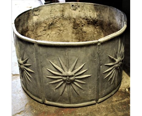 Circular lead garden planter decorated with sunburst design in relief, 19.75ins x 11.5insSmall split and two small holes in s