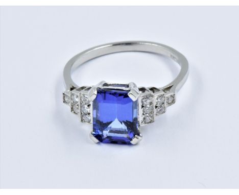 Platinum Art Deco style ring set central tanzanite flanked by diamonds, size NOf recent manufacture. In good overall conditio