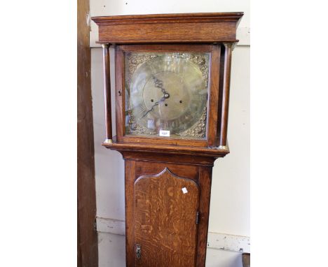 Antique oak longcase clock with a square hood and shaped panel door, the brass dial with a later associated three train movem