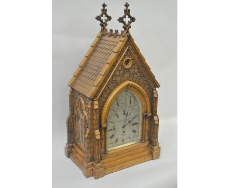 An impressive Victorian Gothic Revival bracket clock, the case modelled in the form of an ecclesiastical building with pierce