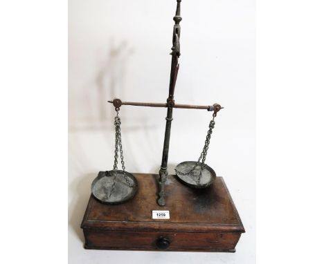 Pair of 19th Century mahogany and brass balance scales with drawer to base 