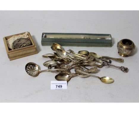 Quantity of various silver coffee spoons, sugar tongs, sugar shaker, set of white metal cocktail sticks, paperknife, a salt a