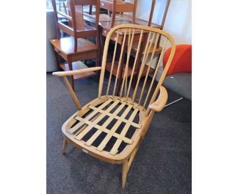Pair of 20th Century low stick back open armchairs in the style of Ercol (later stripped) 