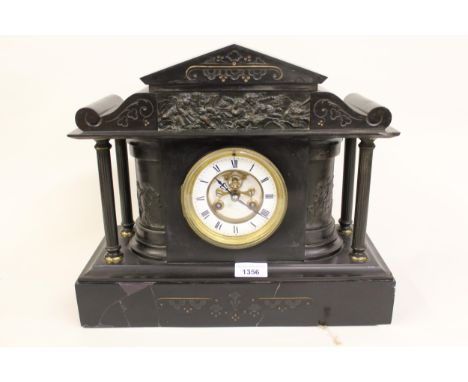 Late 19th century black slate two train manel clock, with visible escapement, together with a walnut mantel clock 