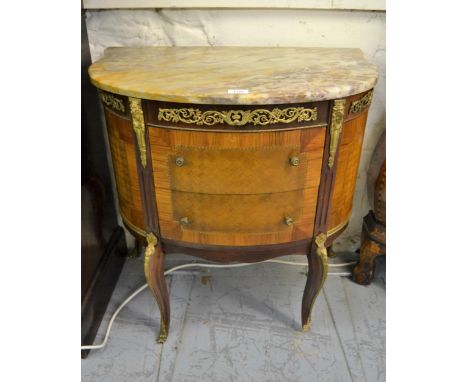 Early 20th Century French parquetry inlaid ormolu mounted bow fronted commode of two drawers, with a marble top (with damages