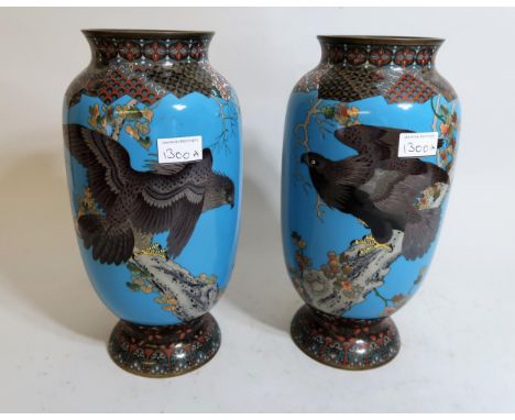 Pair of large Japanese cloisonne baluster form vases decorated with birds of prey on a blue ground, 13ins highOne vase has cr