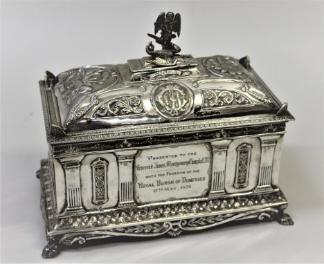 King George V silver freedom casket of architectural form, the hinged lid enclosing a velvet lined interior with an angel and