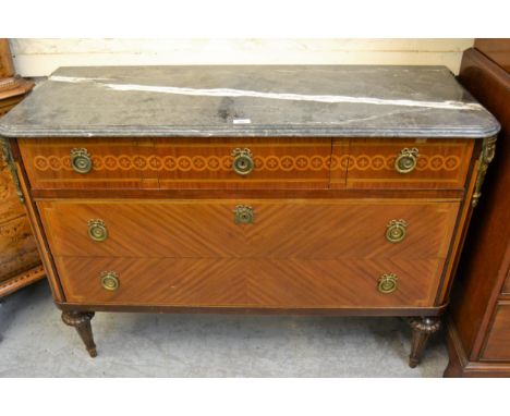 French kingwood marquetry inlaid and ormolu mounted commode, the grey flecked marble top above three short and two long drawe