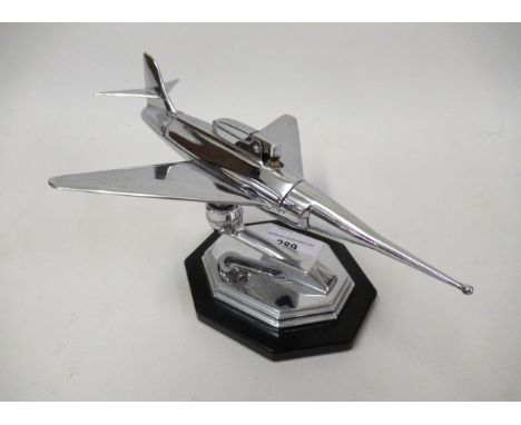 Mid 20th Century chrome plated table lighter in the form of a jet aircraft, on an irregular octagonal base with presentation 