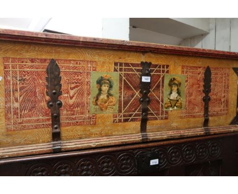 19th Century Continental painted pine and metal bound trunk with hinged lid and applied printed decoration, 45.5ins wideMeasu