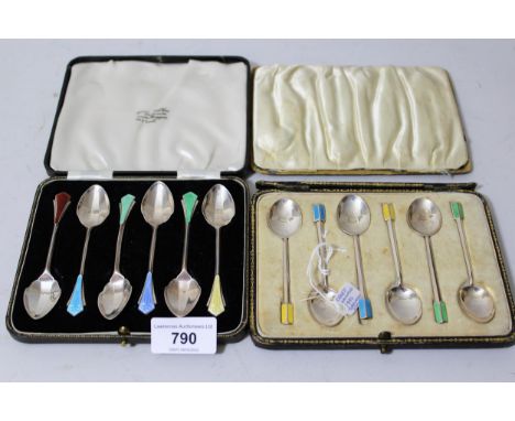 Cased set of six Art Deco silver and enamel decorated coffee spoons, together with a cased set of six similar spoonsBoth sets