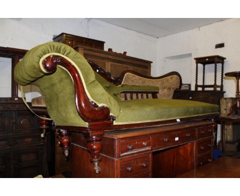 Victorian carved mahogany and green button upholstered chaise longue, the shaped back above an overstuffed seat and turned su