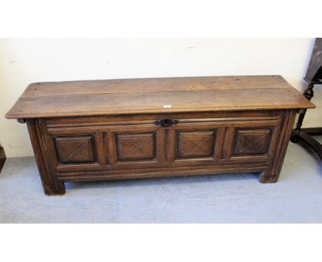 18th Century oak coffer, the hinged top above a four panel front raised on stile feet, 64ins x 18ins x 22ins high 