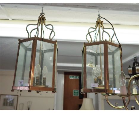 Pair of reproduction gilt brass and glazed hexagonal hall lanterns, 21ins high (minus one glass panel) 