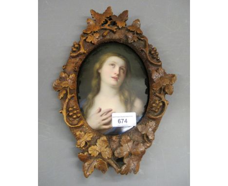 19th Century Continental porcelain oval plaque painted with a portrait of a girl wearing a blue robe, impressed mark verso wi