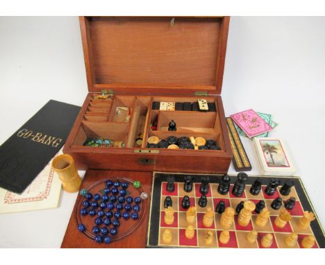 Late 19th / early 20th Century mahogany games compendium, the rectangular box with a hinged cover enclosing a fitted interior