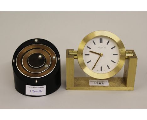 Small mid 20th Century gilt brass desk clock with quartz movement by Tiffany & Co., 4.5ins high together with another modern 