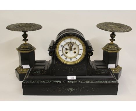 19th Century black slate mantel clock with two train movement and visible escapement, together with a pair of black slate and