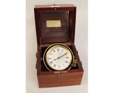 Quartz table clock by Dunhill in the form of a marine chronometer, housed in a mahogany case with brass gimbal 