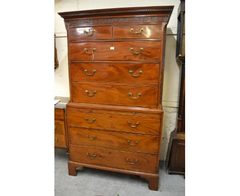 George III mahogany tallboy, the moulded dentil and blind fretwork cornice above two short and three long drawers flanked by 