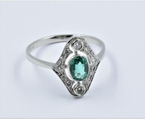 Platinum Art Deco style ring set with central oval emerald surrounded by diamonds, size N.5In good overall condition. Stone s