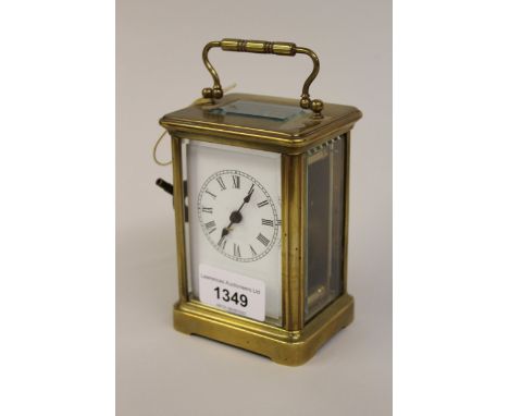 Small French gilt brass carriage clock with enamel dial 