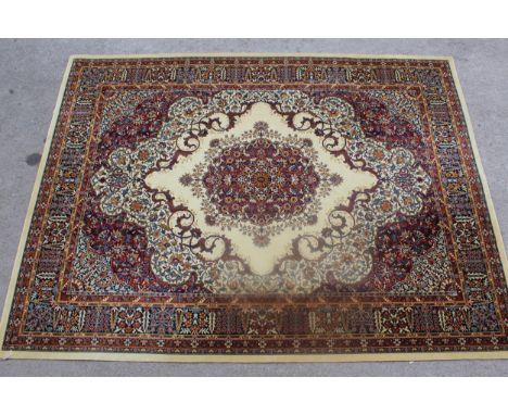 Machine woven Persian design carpet on beige ground, 144ins x 108ins 