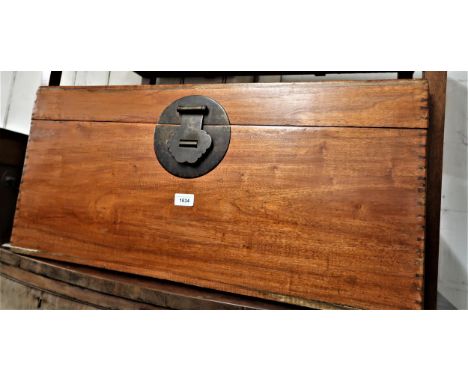 Eastern camphor wood rectangular trunk, the hinged cover above brass lock plate and loop end handles, 31ins wide15ins high x 