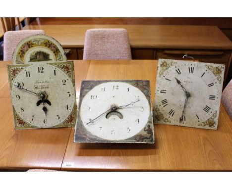 Group of three various thirty clock movements with painted dials 