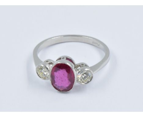 Platinum ring set central oval ruby flanked by two circular cut diamonds, size NGood overall condition. Ruby approximately 8m