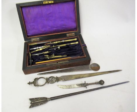 Small rosewood cased set of brass and boxwood drawing instruments, together with a silver plated paper knife in the form of a