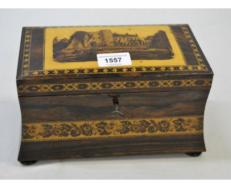 Tunbridge ware two division tea caddy, the dome cover decorated with a castle, the body of wasted form on low bun supports wi