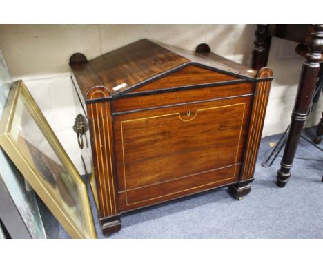 A REGENCY MAHOGANY WINE COOLER with line inlay fitted with frieze drawer standing on  brass castors 61cm x 62cm x 42cm 