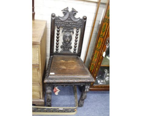 A VICTORIAN MAHOGANY COMMODE STOOL with turned legs 48cm wide together with an antique oak carved hall chair and a Victorian 