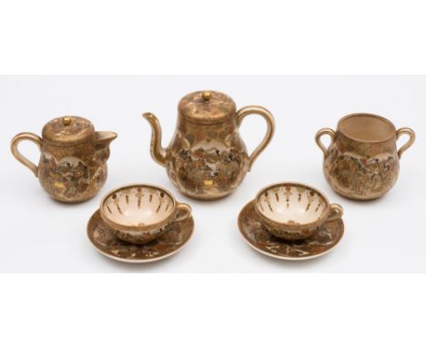 A Satsuma earthenware tea service: comprising a teapot and cover, milk jug and cover, sugar bowl, six cups and six saucers, d