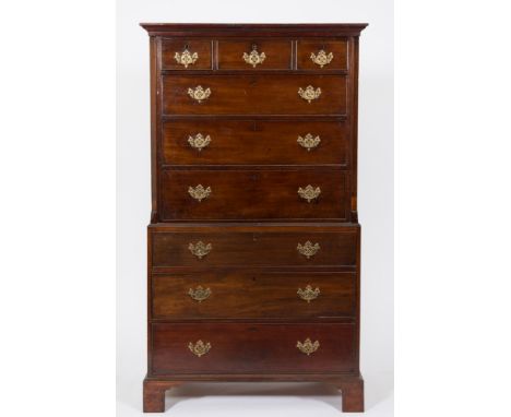 A 19th Century mahogany tallboy:, the upper part with a moulded cornice, fitted with three short and three long drawers betwe