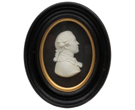 A Wedgwood white and black jasper oval portrait plaque of Sir Joshua Reynolds: incised title and impressed upper case mark, 1