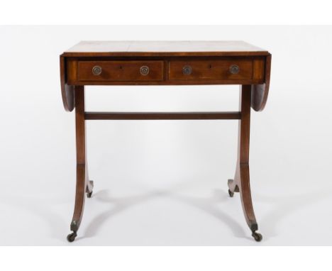 An early 19th Century mahogany and inlaid sofa table:, bordered with boxwood and ebony lines, the satinwood crossbanded hinge