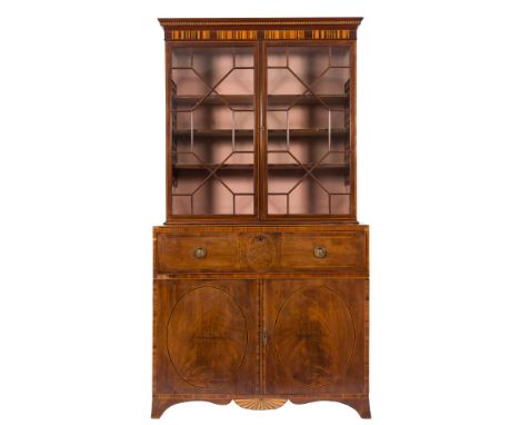 An early 19th Century mahogany and inlaid secretaire bookcase:, bordered with sycamore and boxwood lines, the upper part with