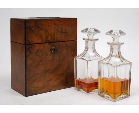 A Victorian  figured walnut and ebony strung travelling decanter box: of rectangular outline, the hinged lid with recessed br