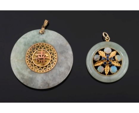 A two-colour jade disc pendant: 47mm diameter, the central gold colour panel with applied Chinese character and an opal and s