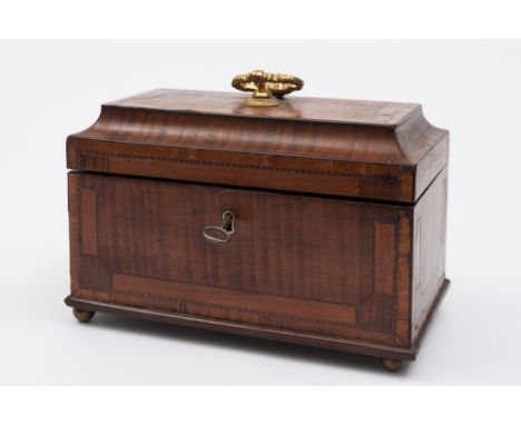 A Georgian mahogany crossbanded and chequer strung tea caddy: of rectangular outline, with shallow domed hinged lid enclosing