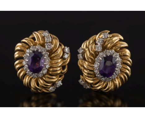 A pair of 18ct yellow gold, amethyst and diamond oval cluster clip earrings: each with a single, oval amethyst within a surro