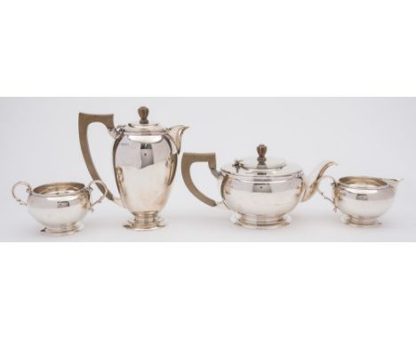 A George VI silver four-piece tea set, maker C.E, London 1941: of plain circular form raised on spreading circular foot, incl