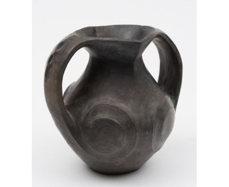 A Chinese black pottery amphora: each flattened loop handle with a pair of indentations, the body carved with spiral motifs, 