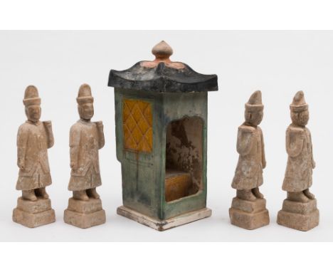 A Chinese pottery sedan chair and roof with four attendant figures: the chair decorated with green and ochre gazes, the figur